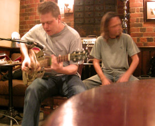 Jason Manners at the Corn Stores, with percussion from Rikk Smith